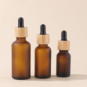 Замороженные коричневые стеклянные бутылки для упаковки с капельницей и бамбуковыми крышками