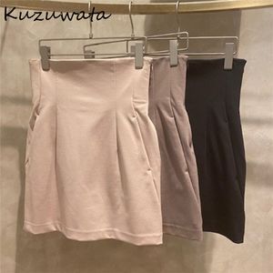 Kjolar kuzuwata solid imperium smala veck över knä sexig mini sommar kvinnors faldas 2023 mode temperament japan stil jupe 230321