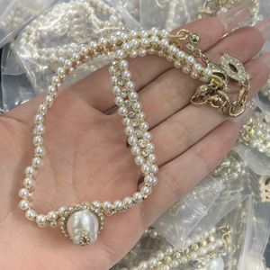 Nytt fashionabla kvinnliga halsbands märke Hot Pearl Chain Channel Planet Halsband Saturn Pearl Necklace Satellit ClaVicle Chain Punk Atmosphere KX5B