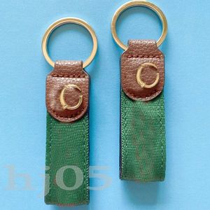 Brown Leather Designer Keychain Retro Luxury KeyChain Simplicity Red Green Webbing Portachiavi Par Creative Valentine S Day Gift Key Ring Delicate PJ055 C23