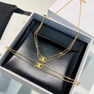 Pendant Necklaces Gold plated long womens love Triangle necklace simple style double deck ins elegant pendant necklaces luxury thin chain brass dangle designe