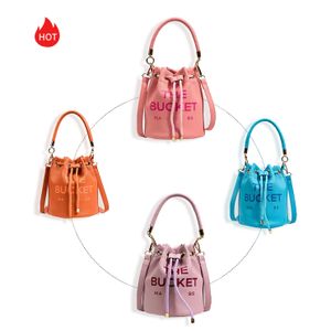 Alça superior Spring outing The Drawstring Clutch Basket bag luxo Designer fashion Crossbody tote bucket bags Feminino Masculino fim de semana PU Cool bolsa Bolsa de ombro Bolsas tipo tiracolo