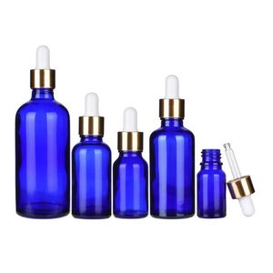 Packaging cosmetico olio essenziale da 5-100 ml di bottiglie di contagocce in vetro blu con cappuccio dorato