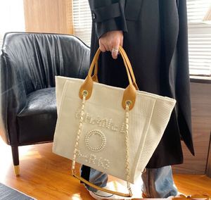 حقائب مسائية حقائب تسوق مصممة جديدة حقائب اليد لؤلؤة شاطئية القماش المحمولة اتجاه الموضة عالي السعة.