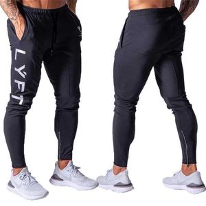 Calças masculinas calças de corrida homens esportam calças de moletom de calça de ginástica masculino homens jogadores trackpants de algodão Slim Fit Pants Bodybuilding Trouser W0325