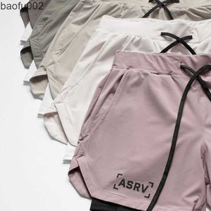 Shorts maschile Nuovi 5 colori Pink rosa mimetico pantaloncini da corsa 2 in 1 Short sport sport di palestra rapida a secco cortometraggi per jogging pantaloni corti pantaloni corti W0327