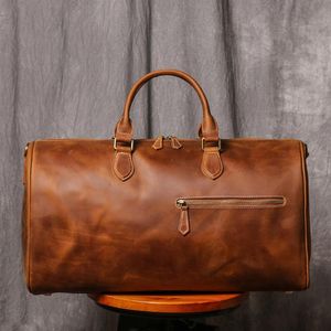 Duffel Bags Luxury Travel Men Vintage Hand Bagage Brown äkta läder Stor kapacitet Business Man Weekender Shoulder Bag