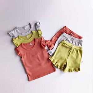 Set di vestiti per bambina da 2 pezzi T-shirt e pantaloncini con maniche a volant per bambini estivi 2 pezzi Tute per bambini Set di vestiti per neonate solidi
