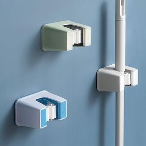 Ganci rotaie a pugno Mop gancio muro appiccicoso appiccicoso clip di stoccaggio montato per bagno senza soluzione di continuità