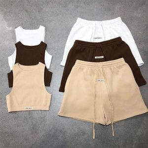 Vestido letra sólida esportiva de duas peças do conjunto de tampas magras com nervuras+ shorts de curativo casual solto combinando o traje feminino