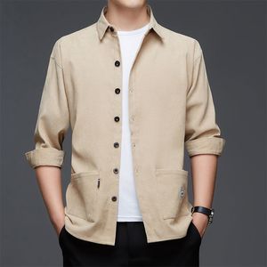 Mäns avslappnade skjortor Stylish Solid Color Lapel Button Spliced ​​Tickets Shirt Men's Clothing Autumn Overdized Casual Tops Loose Korean Shirts 230504