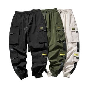 Mens Pants Joggers last för män Casual Hip Hop Pocket Male Trousers Sweatpants Streetwear Ribbons Techwear 230504