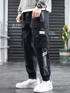 Byxor vår sommar multipockets svarta lastbyxor män streetwear joggar plus storlek casual sweatpants ankel längd manlig byxor