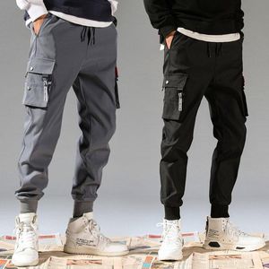 Pantaloni 5xl uomini pantaloni da carico vintage 2020 hip hop maschio khaki tasche nere joggers pantaloni da uomo coreano pantaloni della moda turistica più dimensioni