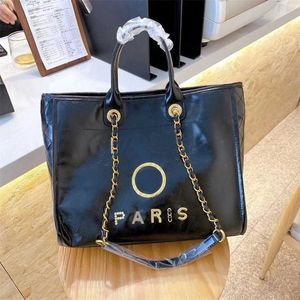 Bolsas de luxo da moda Bolsa de praia Brand Metal Badge bolsa Bolsa pequena bolsa noturna Capacidade feminina Couro grande Uma fábrica de mochila ombro Fábrica de fábrica 70% de desconto em YCTU