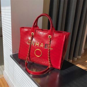 Bolsas clássicas de luxo Bolsas de praia Brand Metal Badge Tote Bag Small Bolsa Evening Capacidade Feminina Couro grande Uma fábrica de mochila ombro Fábrica de fábrica 70% de desconto em J564