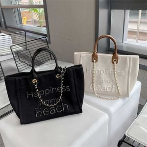 50% di sconto in fabbrica online Nuova piccola tela profumata con catena a mano in pelle Borsa da spiaggia con perle Mommy Tote monospalla da donna