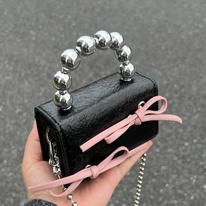 Designer Fashion Mini Shoulder Bags Bowknot Black White Cross Body Bags Lipstick Air Cushion Headphones Small Makeup Organizer