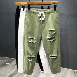 Mäns jeans japanska trend Men rippade hål jeans vit grön svart ankel längd ungdom mode lös denim harem lastbyxor 230506