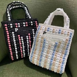 Boncuk Sepet Straw Bag Raffias Bayan Erkek Debriyaj Totes Güneş Işığı Tasarımcı Plaj El Çantası Lüksler Dokunma Üçgen Prad Omuz Çantaları Seyahat Crossbody Siyah Çantalar