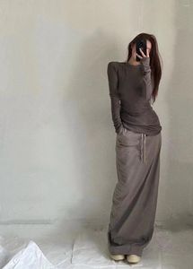 Modele designerskie spódnice czarny nisza ciemna kolumna sznurka szczupła szczupła sukienka na pół ciała