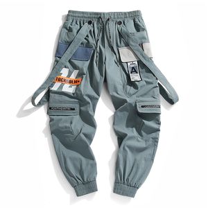 Qnpqyx nowe męskie streetwear japońskie spodnie ładunkowe Mężczyźni drukujący list modne paski męskie kieszenie patchwork luźne spodnie