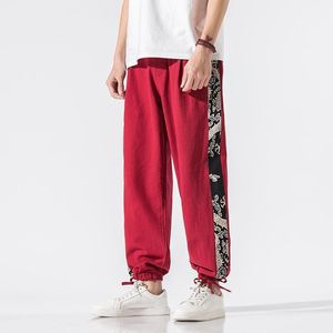 Męskie spodnie 2023 Mężczyźni Chiński styl czerwony lniany nadruk streetwearu szerokie nogi męskie workowate jogger harem kroplne spodnie