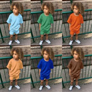 Set di abbigliamento Tuta essenziale estiva Tuta per bambini per ragazze Top a maniche corte e pantaloncini Costumi per ragazzi Completi per bambini Abbigliamento sportivo