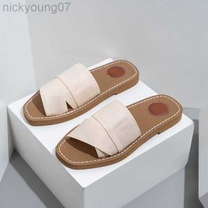 Slippers 2023 Summer New Fashion Canvas Sandals planos e chinelos Designers Sapatos femininos Praia plana Flippers femininos Y23