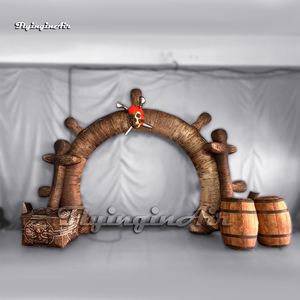 Fantastica grande porta d'ingresso del club con replica del timone della nave pirata ad arco gonfiabile con scatola del tesoro e botti di vino per spettacoli di feste a tema marino