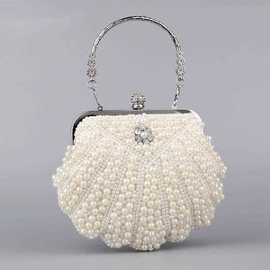 Kvällspåsar Pearl Shell Handväskor Nya kvinnliga axelvit pärlpartiklar för kvinnor 2023 Trend Luxury Bolso Mujer 230427