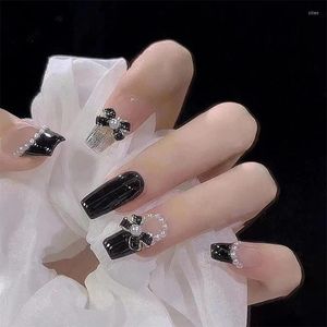 Falska naglar bow nagelkonst svart och vit pärla diamant långa produkter återanvändbara lim falska förnödenheter lim press saker designer