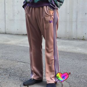 Męskie spodnie 2023 Igły bootkutowe Ścieżki mężczyźni kobiety Wysokiej jakości Poly gładki motyl Purple Purple Moders 230515