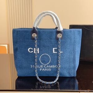 2023 Channel Beach Bag Stor designer Väskor axelväska duk butik plånbok på kedja tote handväska pärla shopping väska vita handväskor