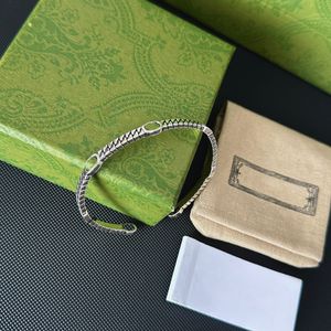 Bracciale rigido di alta qualità con bracciale in acciaio al titanio con lettera G intrecciata, regalo per gioielli di moda da donna