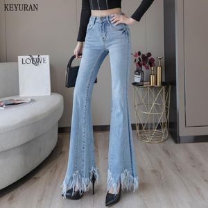 Jeans burr tassel kvinnor hög midja stretch klocka botten kläder blå denim blossade byxor breda ben byxor faller kvinnor avslappnad