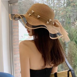 ワイドブリム帽子バケツ韓国スタイルの女性ストローガーゼジョイントボウリボン大サンシェードインシングセレブアウトファッションビーチホリデーグレイシャーハット230517