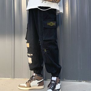 Novo estilo encadeamento de pés de encadernação de bolso grande de bolso casual calças para homens e mulheres versáteis versáteis simples cor de cor sólida design de rua calças de tendência