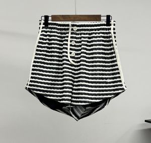 النساء القصير أزياء جديدة C عتيقة مخطط مخطط placket shorts مرنة الخصر