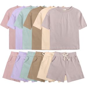 Roupas conjuntos de traje de traje essencial do verão para meninas de manga curta Topshorts meninos fantasia de crianças roupas esportivas 230522