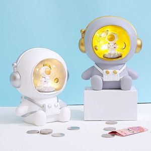 Nowe figurki 1pc urocze kreatywne dzieci astronauta piggy bank kreskówka anime spaceman winylowe monety banknotowe świnki brzegowe pensje bezpieczne dekoracje domu g230523