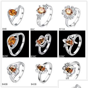 Solitaire Ring Eye Flower Champagne Gemstone 925 Sier Rings GTGR16 Online till salu Sterling Plated 10 stycken Mixed Style Drop Delive Dh8ye