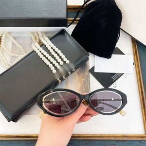 Designer Fashion luxury cool sunglasses Super high quality family personality oval cat's Eye Sunglasses Women's net red samayu same pearl chain ch5424 with logo box