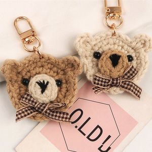 Llaveros de oso con lazo tejido de lana hechos a mano, decoración colgante de auriculares, llaveros de animales tejidos bonitos para mujer, regalos de fiesta de boda