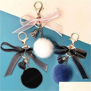 Portachiavi Moda Pizzo Bowknot Portachiavi a sfera rotonda per donna Ragazza Carino Pompon Pelliccia di visone finto Borsa a catena Charms Portachiavi Regalo per feste Orna Dhjpx