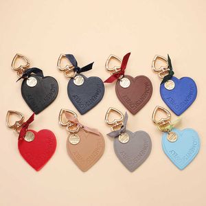 Keychains Ins South Korean Love Leather Heart shaped Car Keychain Men's and Women's Backpack Pendant G230525