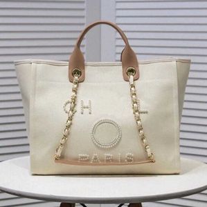 Luxury Women's Hand Canvas Beach Bag Tote Handväskor Klassiska stora ryggsäckar Kapacitet Små kedjepaket Big Crossbody De6Z