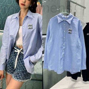 Women's Blouses & Shirts designer spring tel emroidered Emroidered ue and white tical stripes color mating medium long Lapel shirt loose HX8N