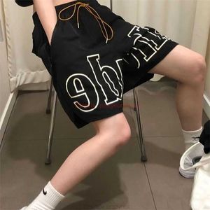 デザイナーショートファッションカジュアルカジュアルビーチショーツブランド新しいRhude Drawstringメッシュバスケットボール通気性ハイストリートパンツジョガーズスポーツウェー