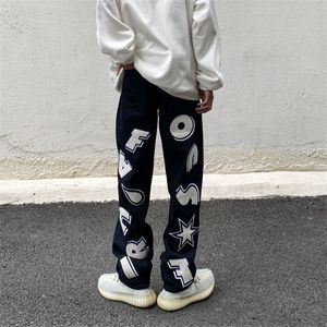 Męskie dżinsy Hip Hop Letter Drukuj Drukuj dżinsy o niskiej talii Proste worka dżinsowe Ubrania Spring Y2K Men Korean Streetwear Fashion 230529